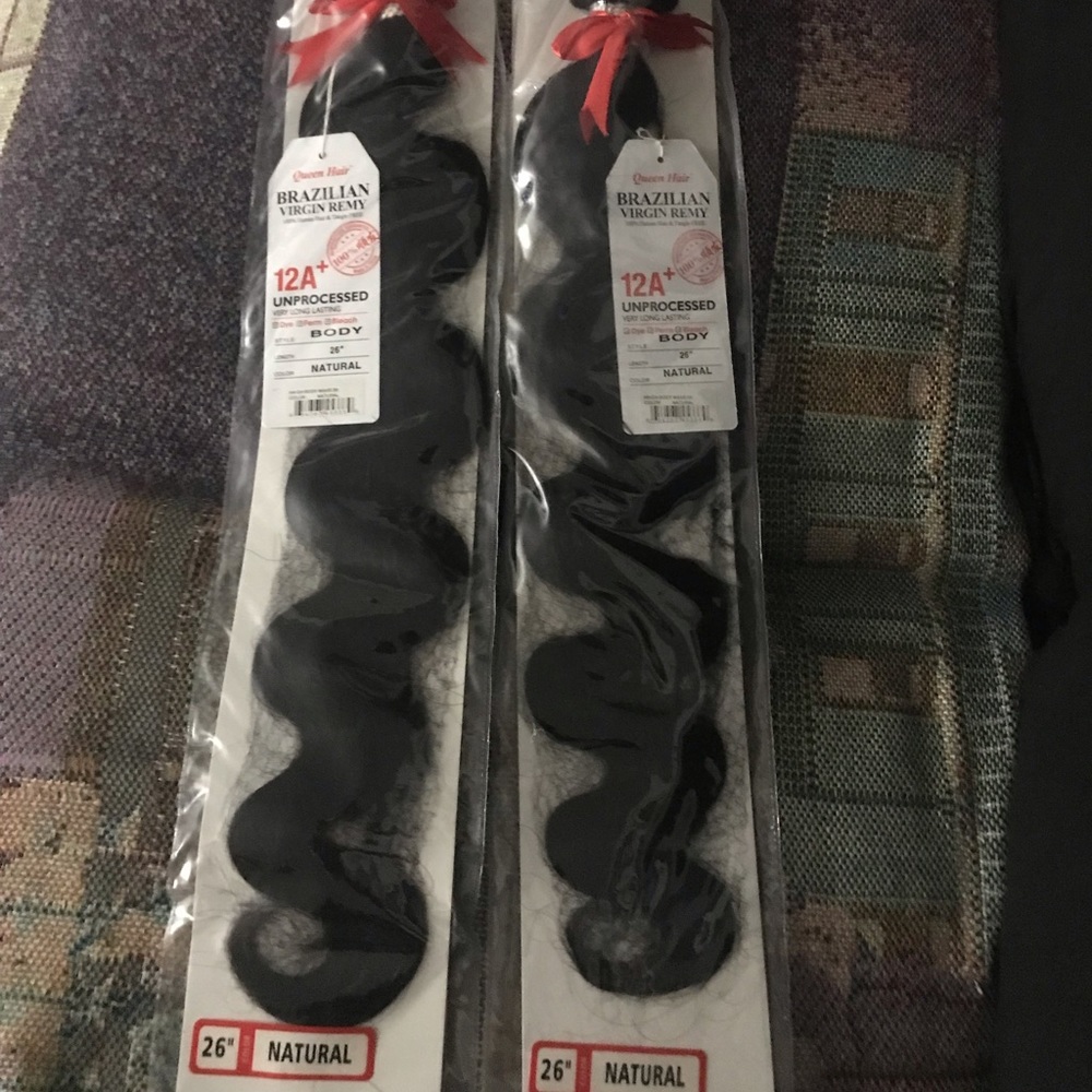 26 inches of virgin human hair. Dyes and bleaches great. Body wave